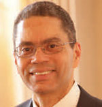 Bruce Seigel has short gray hair and glasses.