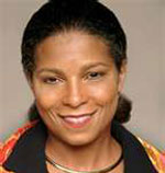Risa Lavizzo-Mourey has black hair tied back. She is wearing a black and orange printed shirt.
