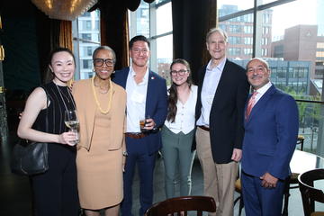 A few fellows pose with Joan Reede, Joe Betancourt, and David Blumenthal.