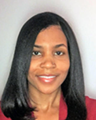 Jennifer Parker has medium straight black hair. She is wearing a red blouse.