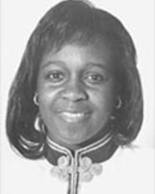 A black-and-white photo of Anita Moncrease. She has short straight black hair.
