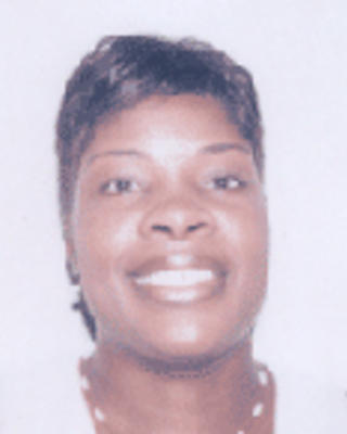 LaQuandra Nesbitt has short black hair.