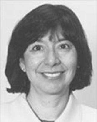 Nancy Torres has chin-length straight dark hair. 