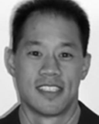 Wilson Wang has short black hair.