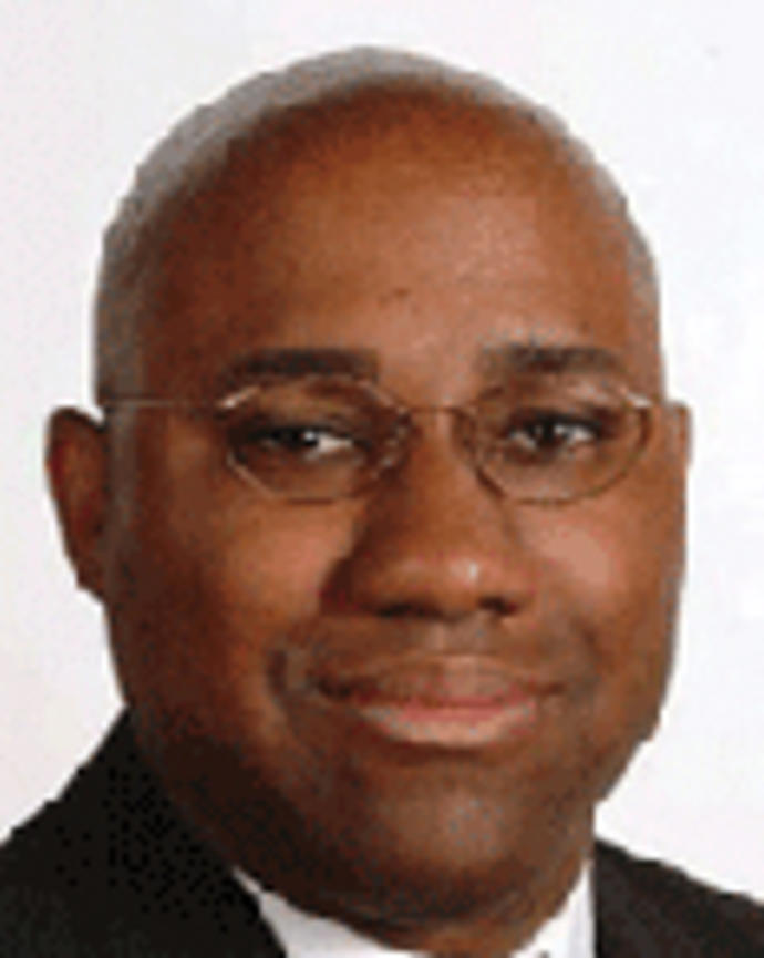 Mallory Williams is a bald man with glasses.