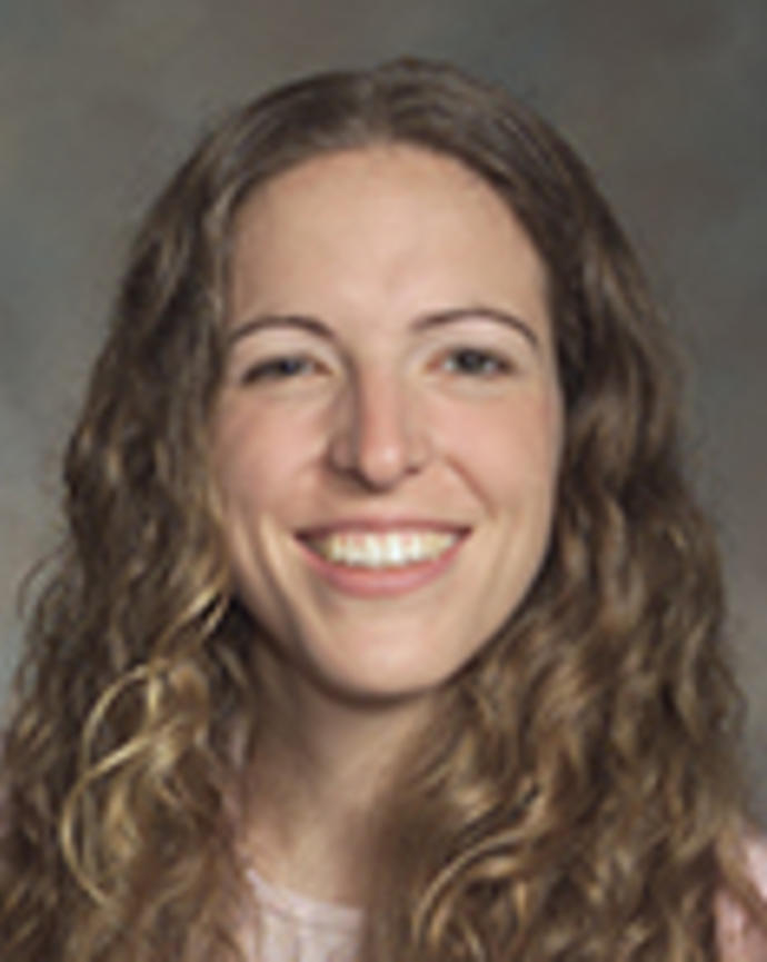 Samantha Rosman has long curly blong hair.