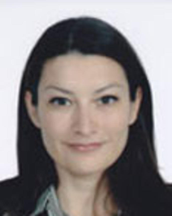 Susan Saucedo has medium-length straight black hair.