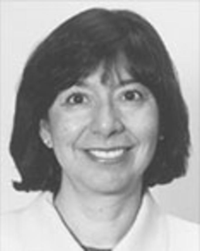 Nancy Torres has chin-length straight dark hair. 