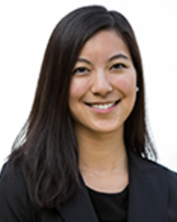 Tracy Yang has long straight black hair. 